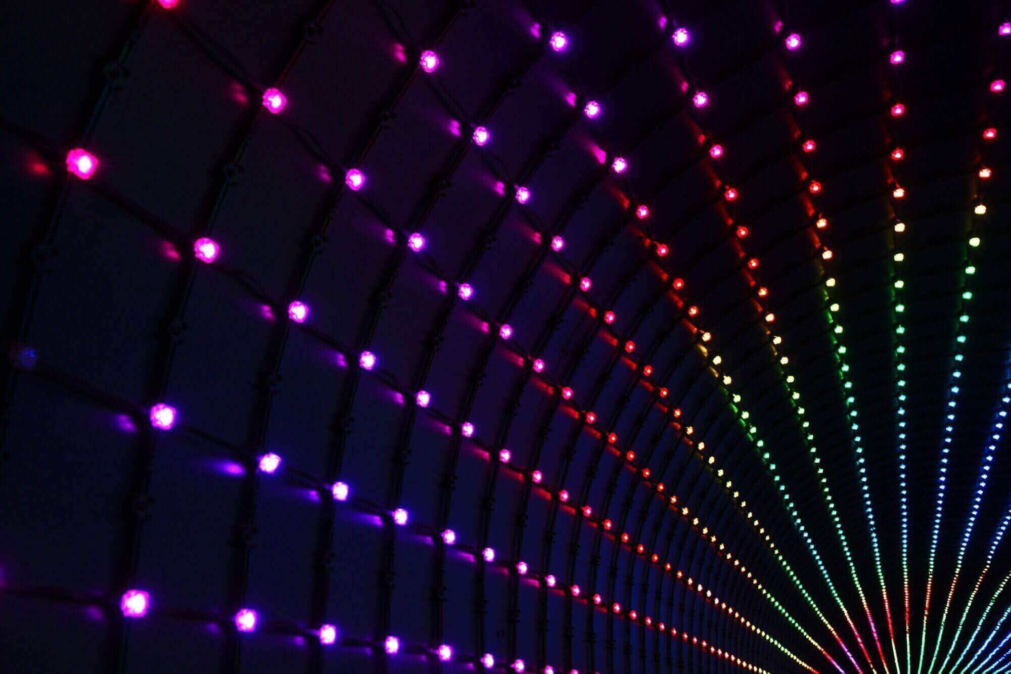 Tons of multi colored lights in a tunnel