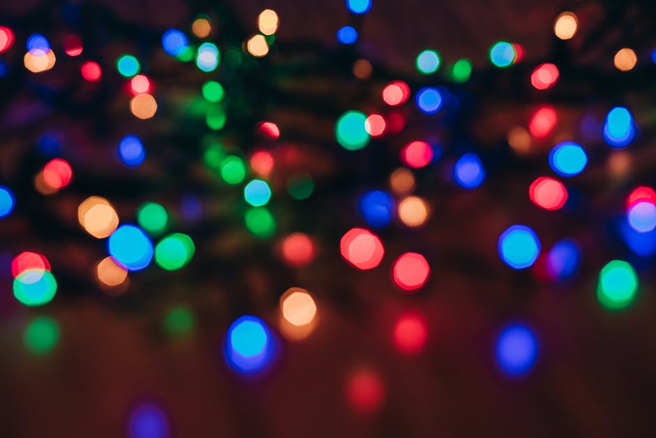 colored christmas tree lights on floor of living room